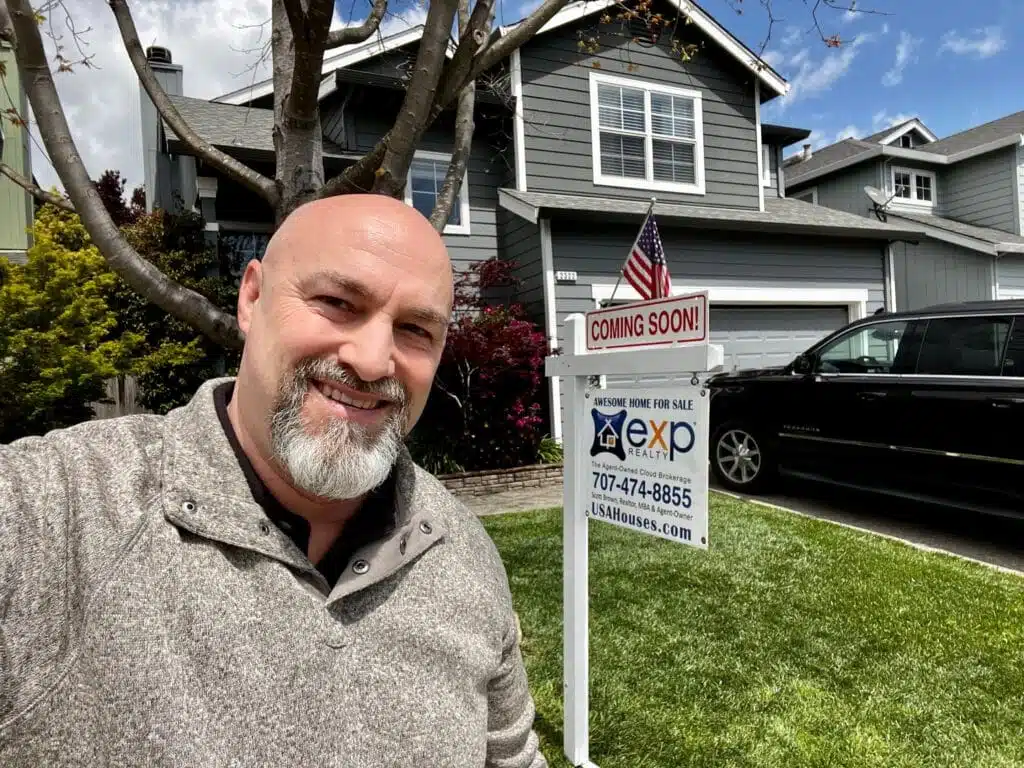 Real estate broker Scott Brown standing in front of a Northern California home for sale with a coming soon sign. Tell me "sell my home". Sold, Santa Rosa CA, Sonoma County California, Wine Country.