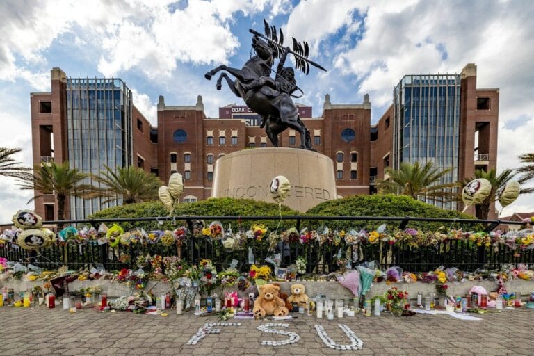 Flowers are placed at the florida state university memorial. you can graduate then look for new homes for sale in the Tallahassee real estate