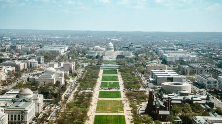 Washington D.C. skyline featuring residential neighborhoods and the local real estate market, an aerial view of the capitol building in washington dc