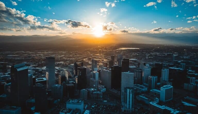 Denver Colorado. View of the sun is setting over a large city