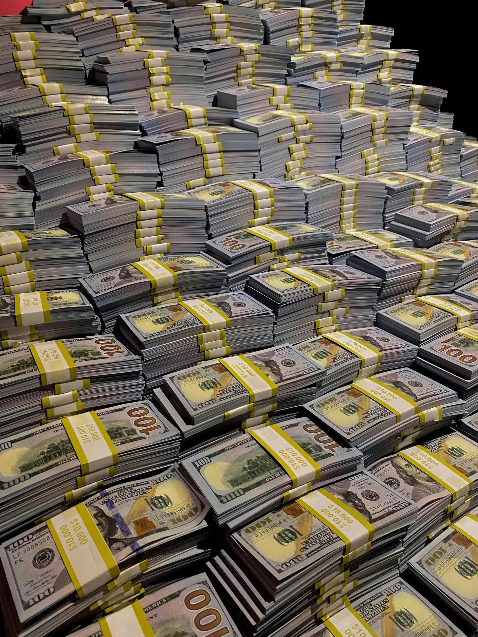 USA Lending. Funding. Large piles of 100 US dollar bills neatly stacked, symbolizing wealth and financial abundance. Cost of waiting to buy a house, financing rental properties
