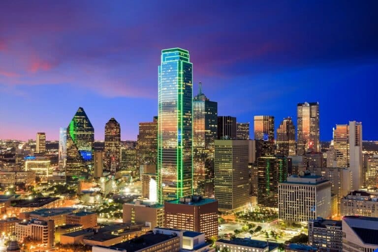 In Dallas Texas, a view of a city at night from the top of a building. Dallas Fort Worth